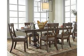 A dining room is so much more than just a table with chairs. Windville Extendable Dining Table Ashley Furniture Homestore