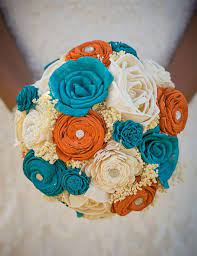 Café au lait dinnerplate dahlias (combined with smaller maroon versions) anchored alix's bouquet, made by munster rose. Paper Flowers Wedding Bouquet Teal And Orange Bridal Bouquet Orange Bridal Bouquet Bridal Bouquet Bridal Bouquet Fall