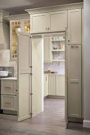 A white kitchen cabinet can offer more counter space or additional shelving for essentials like pots and pans. Pantry Walk Through Cabinet Diamond Cabinetry