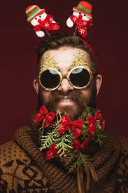 Funny bearded man in a New Years image with snow and decorations