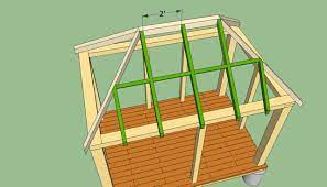 The triangular roof is made of wooden slats; Wooden Gazebo How To Build A Gazebo Roof Novocom Top