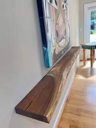 This type of shelf uses a special construction to give the appearance that the shelf is extending directly out of the wall with. Live Edge Walnut Floating Shelf Various Sizes With Floating Bracket And Hardware Included Solid Walnut Single Slab Walnut