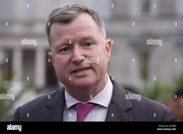 Malcolm Byrne from Fianna Fail arrives at Leinster House in Dublin ahead of  the first sitting of the new Dail since the Irish general election. The 174  TDs will vote by secret