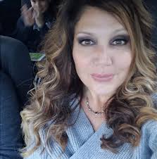 Green metal bakers rack with 11 bottle wine rack. Microwave stand