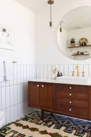 Beyond tile trends, this home oozes coastal style and has beautiful lighting, furniture, and wood details. An Interior Designer S Eclectic Coastal Mid Mod Reno Bathroom Decor Apartment Mid Century Modern Bathroom Inexpensive Bathroom Remodel