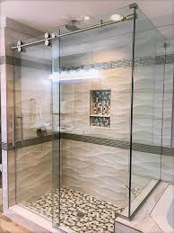 Barndoor Style Shower Door With A 90 Degree Return Panel Featuring 3 8 Glass And Stainless Steel Hardware Shower Doors Glass Shower Glass Shower Enclosures