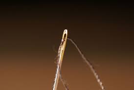 Threading a sewing needle is made simple with these tips and tricks. File Sewing Needle Eye With Thread Jpg Wikimedia Commons