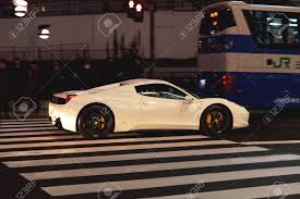 Production of the f12tdf was limited to 799 units. Tokyo Japan December 26 2015 A White 458 Italia Ferrari Sports Car In Central Tokyo Street Stock Photo Picture And Royalty Free Image Image 132498745