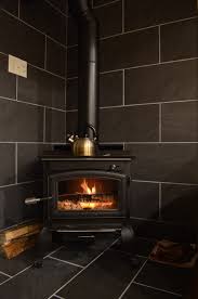 Learn how to make a slate herringbone diy hearth pad. Slate Or Porcelain Tile For The Wood Stove Surround
