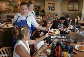 Waitresses Gretchen Boren and Michelle Enright wait on customers ...