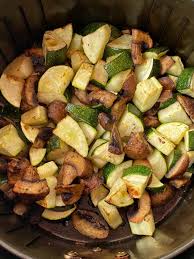 Once the zucchini is sliced, place them into a large bowl and toss with olive oil, parmesan cheese, garlic powder, salt and pepper along with fresh rosemary. Air Fryer Zucchini And Mushrooms Melanie Cooks