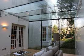 Glass Box Extensions With Glass Beams Supporting The Structural Roof By Iq Glass Glass Extension Glass Structure Contemporary Patio