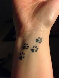 Black paw and heart in infinity tattoo on wrist. 27 Cute Paw Tattoos Images Pawprint Tattoo Paw Tattoo Wrist Tattoos For Guys