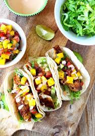 Sprinkle fish with chili powder, cumin, salt and black pepper. Blackened Fish Tacos With Mango Salsa Sriracha Aioli Lemon Blossoms