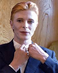 Not much evidence of a mirror in this first shot from 1975 of Bowie as  Thomas Jerome Newton, until you look at those famous eyes. All is revealed  in the uncropped image