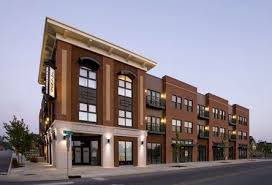 A Traditional Mixed Use Development That Uses Brick And Stucco Retail Architecture Mix Use Building Mixed Use Development