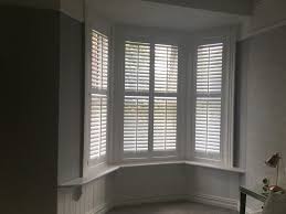 Custom paint plantation shutters with 2 1/2 slats. Bay Window Plantation Shutters Uk Blinds And Shadings