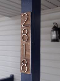 modern house numbers plaque on stained wood etsy modern house number house numbers house number plaque