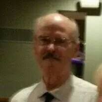 Man changes tire at gas station in Yuma