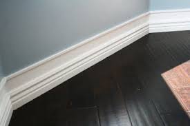 Get Bigger Baseboards Without Ripping All Your Old Ones Out By Adding Small Molding A Few Inches Above And Paint Wall Space Baseboards Home Diy Home Remodeling