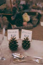 Pine Cone Place Cards Are A Really Simple Rustic Wedding Decoration That Transforms Y Winter Wedding Table Winter Wedding Decorations Wedding Table Decorations