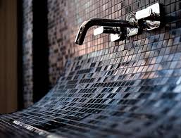 curved bathroom sink in mosaic tile