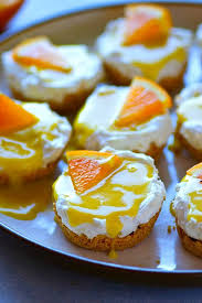 These Creamy Orange Curd Mini Cheesecakes Are Completely No Bake And Can Be Prepped Within Minutes A Tan Mini Orange Cheesecake Orange Baking Mini Cheesecakes