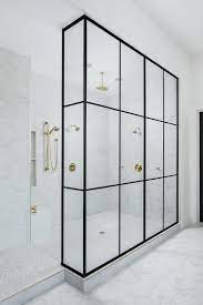 They are, essentially, a large glass panel that fits snugly between your wall and the edge of your bath, providing a stylish way to enclose your. Marble Herringbone Bathroom Floor Tiles Lead To A Walk In Shower Boasting A Large Ste Herringbone Bathroom Floor Brass Shower Marble Herringbone Bathroom Floor