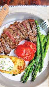 Meredith Laurence S New York Strip Steak With Baked Potatoes And Asparagus Easy Dinner Recipes Crockpot Entree Recipes Baked Steak