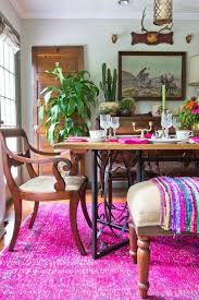 This idea combines both vibrant chairs with a wooden table that is able to tone down the vibrant colors. Eclectic Home Tour Far Above Rubies Boho Dining Room Dining Room Design Bohemian Style Dining Room