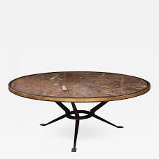 The table measures 32 in diameter and is 18 ¼ high. French Vintage Iron And Fossil Marble Coffee Table