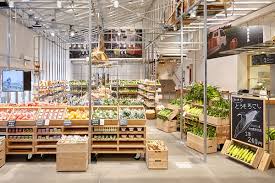 Fresh carrots with green leaves over wooden. Muji Market The One Centre
