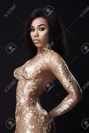 Naked Dark-skinned Woman In Gold Stock Photo, Picture and Royalty Free  Image. Image 123004797.