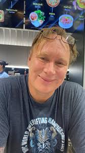 Can someone restore my boyfriend's hair in old photos?