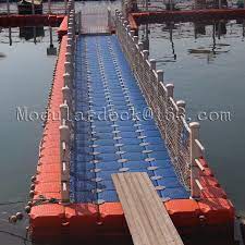 The plate shall be securely attached to the first walkway module with a heavy duty aluminium piano hinge and be designed to remain in the horizontal position if the module rises. China Plastic Hdpe Floating Pontoon Walkway Bridge For Sale China Floating Dock Plastic Pontoon Cubes