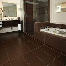 Floor tiles represent a resilient, practical and easily cleanable flooring option for kitchens, hallways, living rooms and more. Stgermain2 Brown Bathroom Bathroom Floor Tiles Bathroom Flooring