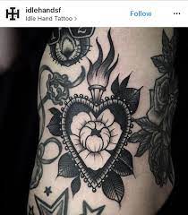 How are the flowers on a heart tattoo? Sacred Heart Tattoo Sacred Heart Tattoos Traditional Heart Tattoos Flame Tattoos