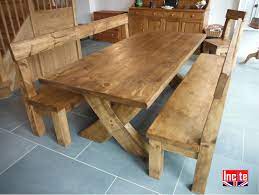 What you do on your dining table in your free time is your own business. Derbyshire Handcrafted Plank Crossed Leg Table By Incite