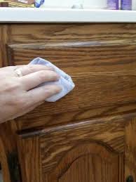 Easily Renew Wood Cabinets Without Actually Refinishing In 2020 Cleaning Wooden Cabinets Stained Kitchen Cabinets Restore Wood