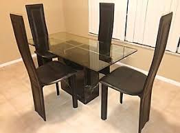 The ease of a quick cleanup, paired with the sleek this round dining table is based on a metal construction, making it a reliable and durable piece of furniture. Artedi Marble And Glass Top Dining Table Ebay