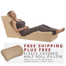 A back seat bed includes two separately inflated feet that support the mattress, fit into the spaces in front of the seats, and contour around the console. Backmax Foam Bed Wedge Body Cushion Bed Wedge Body Cushion Wedge Cushion