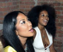 Malcolm X and his daughter Qubilah Shabazz leaving the Hotel Theresa the  day before his assassination in Harlem (1965)