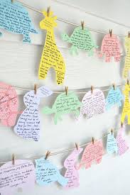 A great alternative guest book at the shower, let your guests sign your guestbook by putting their mark in a bunch of floating balloons. Easy Unique Baby Shower Guest Book Alternatives Tulamama