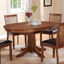 Round top pedestal dining table with 12 in. Winners Only Broadway Round Table With 18 Butterfly Leaf Mueller Furniture Dining Tables