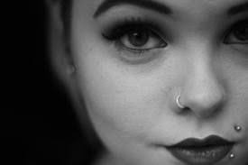2 Closeup Photos Of Girl With A Nose Ring Monroe Labret Piercing Wearing Lipstick Eyeliner Long False Eye Labret Piercing Earings Piercings Nose Ring