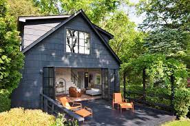 This modern farmhouse cottage is a dream and full of inspiring ideas, inside and out! Charming Midcentury Modern Cottage Overlooking The Hudson River