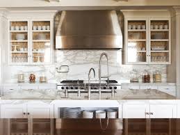 kitchen cabinets lined with wallpaper
