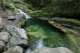 The hike on the stone house property is easy, with only slight elevation changes. Rattlesnake Flume Pool