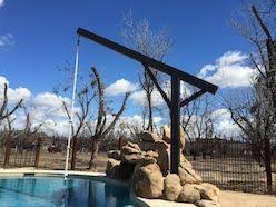 They will cool off on hot days, and your backyard will be the most fun place in town. Pin By Leslie Tate On Creek Rope Swing Swimming Pond Outdoor Improvements Natural Swimming Ponds