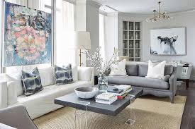 The standard coffee table height is between 16 and 18, however, we recommend choosing a coffee table height that pairs well with your sofa. Gray Leather Sofa With Gray Lucite Coffee Table Transitional Living Room